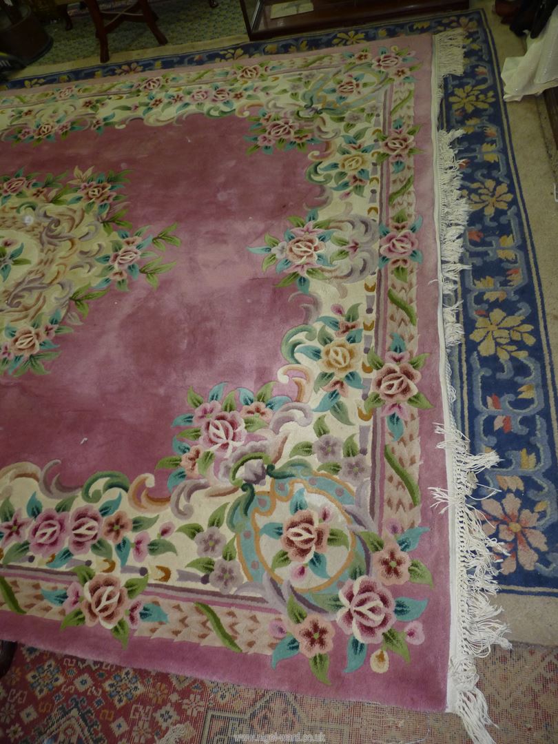 A large pink Chinese carpet, 140" long x 103 1/2'' wide. - Image 7 of 9