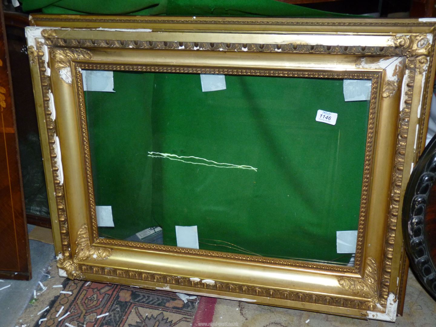 A large period gilt frame with glass, some restoration needed,
