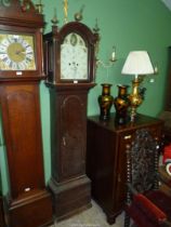 An Oak cased long-case Clock having a painted arched face with Arabic numerals,