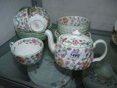 A quantity of Minton Haddon Hall china to include plate, cups and saucers, teapot, etc.