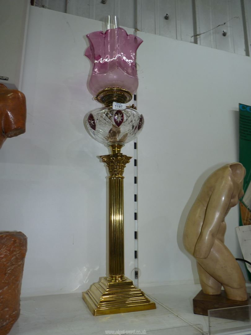 A Brass Oil lamp with Corinthian column base,