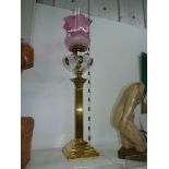 A Brass Oil lamp with Corinthian column base,