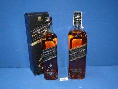 Two bottles of Johnnie Walker Black Label whisky (one boxed), 1 litre and 70 cl.