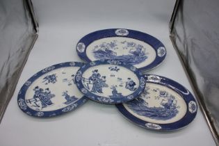 Two blue and white Burslem meat plates and two blue and white Wood & Sons meat plates.