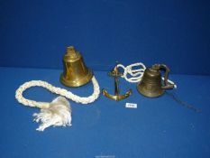 A modern brass ship's Bell with rope pull, plus another bell.