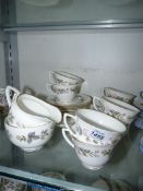 A Royal Worcester 'June Garland' part Teaset to include; eight cups and tea plates, milk jug,