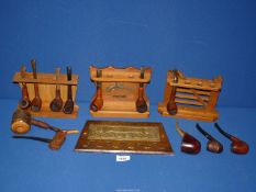 Four wooden pipe racks and twelve briar and rustic smoking Pipes to include: Falcon, Trident,