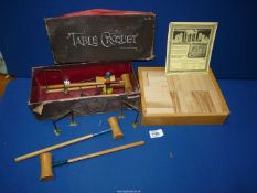 A set of architectural wooden bricks in fitted box and a boxed 'Chad Valley' table croquet set.