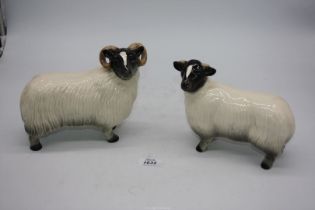 A pair of large Coopercraft, Blackface Ewe and Lamb sheep figures, 7" tall x 8" wide.