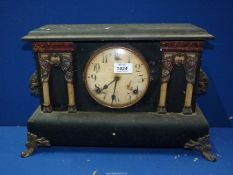 A classical style wooden mantle clock, 17'' wide x 11'' high x 5 1/2' deep.