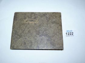 An autograph book containing autographs from 1955 Rugby Wales v England/India and 1950's Cricketers.