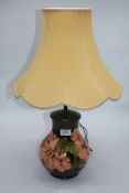 A Moorcroft lamp in Hibiscus pattern, 14 1/2" tall (excl. shade).