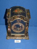 A small chinoiserie decorated mantle Clock with oriental decoration,