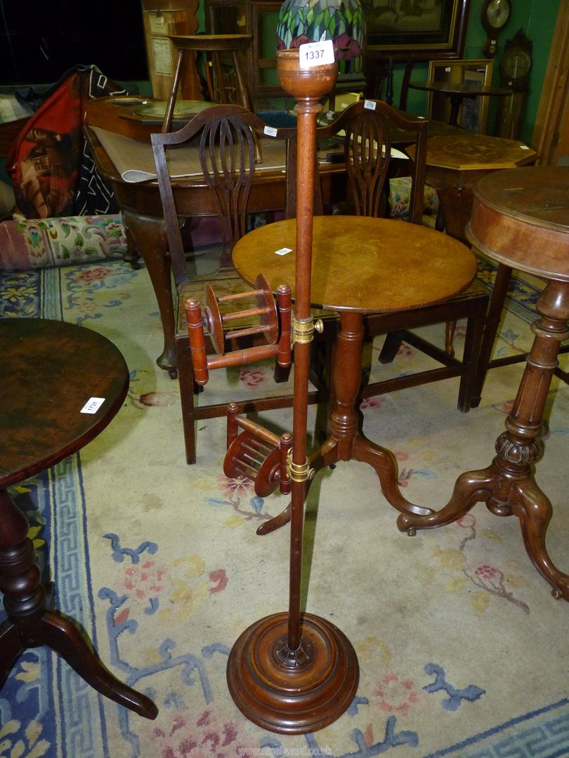 A Mahogany wool winder on circular base, 46" tall.