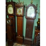 An Oak cased long-case Clock having an eight day movement striking the hours on a bell,