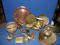 A large quantity of brass and copper including plates, teapot, horse and cart, jardiniere, urn, etc.