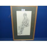 A framed and mounted Pencil sketch of a young man in a seated position, signed lower right J.
