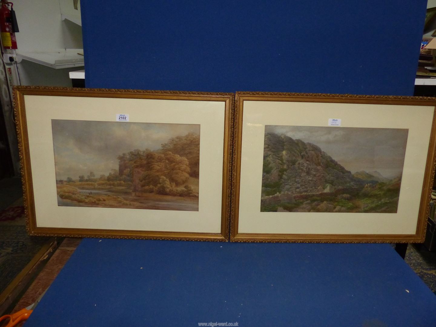 A pair of framed and mounted Watercolours one of a river landscape with figures,