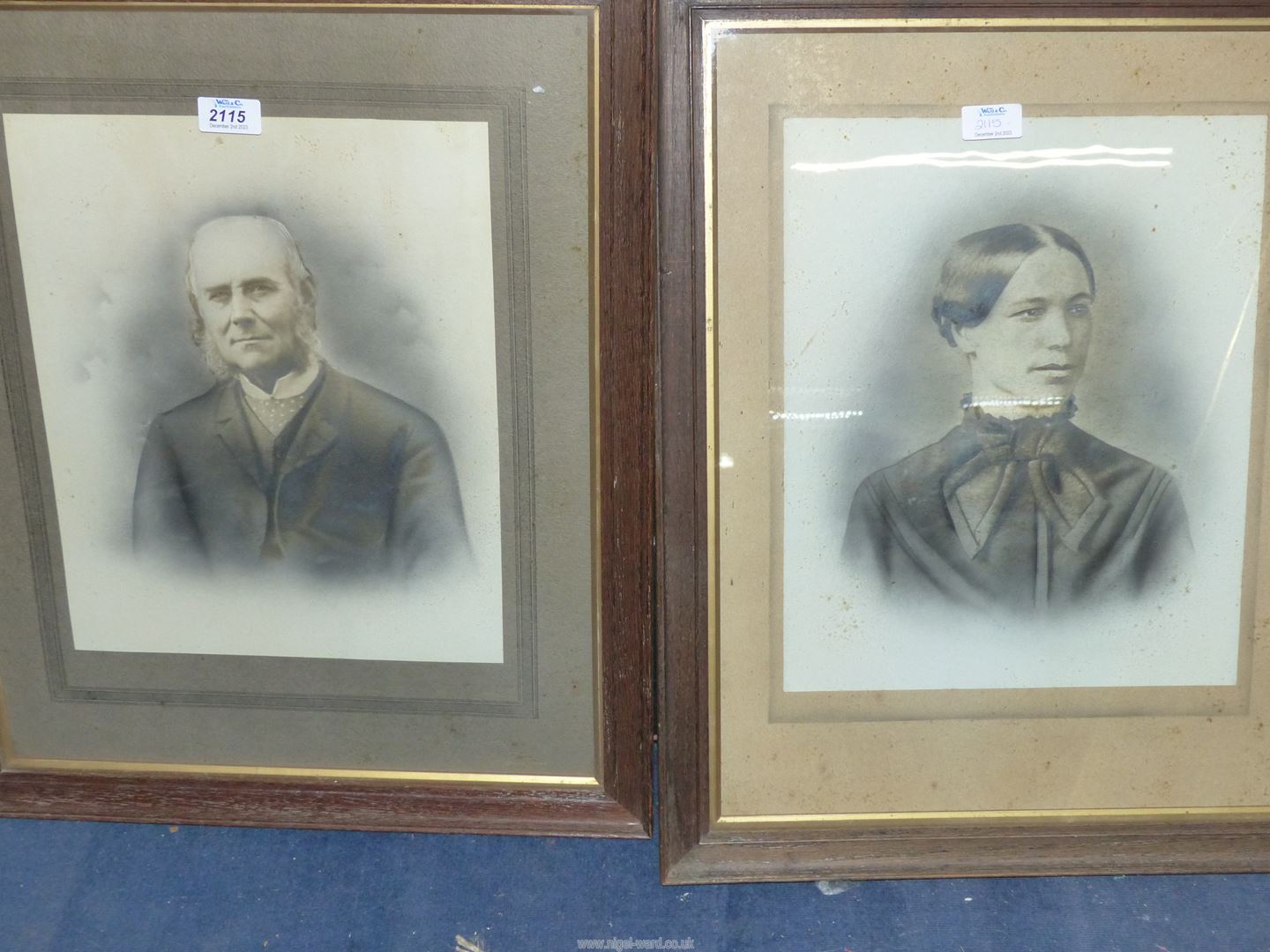 Two wooden framed black and white Portraits of a lady and gentleman taken from photographs.