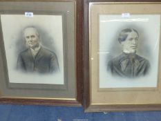 Two wooden framed black and white Portraits of a lady and gentleman taken from photographs.