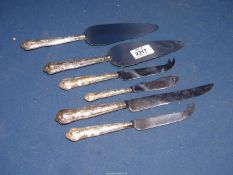 A small quantity of silver handled cutlery, cake slices, cheese knives, etc., Sheffield.