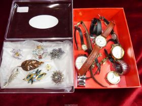 A quantity of costume jewellery to include; brooches and mixed watches including; Thomas Carter,