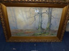 A large framed watercolour of a woodland scene, indistinctly signed lower right,