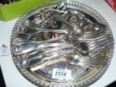 A small quantity of EPNS including; souvenir spoons, dinner forks and a small galleried tray.