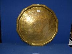 A large brass engraved tray, 22" diameter.