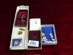 A small quantity of sterling silver charms including fish, duck, etc.