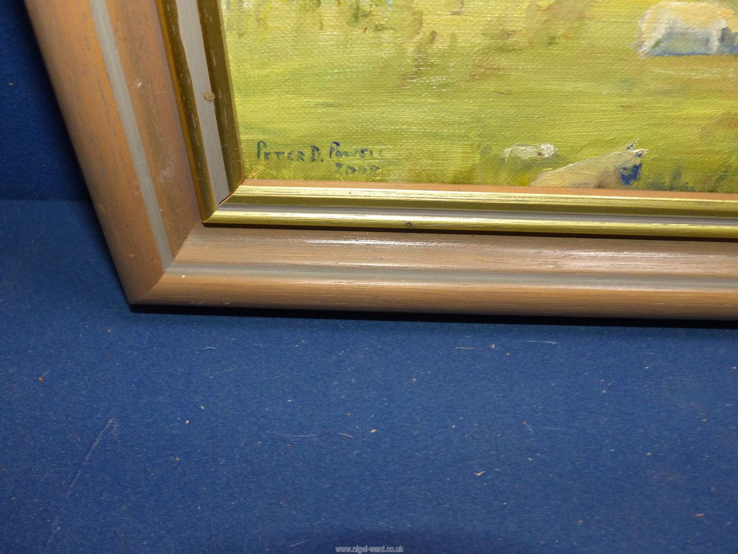 A framed Oil on canvas depicting a river scene with figures in a boat and ewes and lambs grazing, - Image 2 of 2