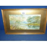 A small framed and mounted Watercolour of a river landscape with swans swimming,