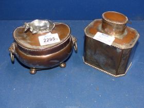 Two pieces of Georgian silver plate including a tea caddy and sugar bowl with silver cow ornament,