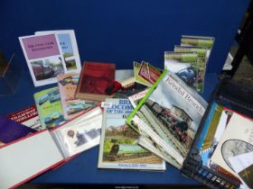 A crate of railway and post card albums, dvd's, books, etc.
