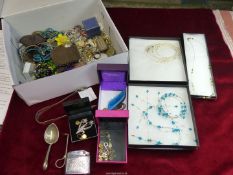 A quantity of costume jewellery including brooches, beaded necklaces, earrings, lighters, etc.