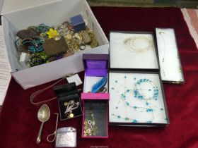 A quantity of costume jewellery including brooches, beaded necklaces, earrings, lighters, etc.