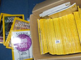 A quantity of National Geographic magazine.