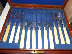 A twelve setting canteen of fish eaters in Mahogany case.