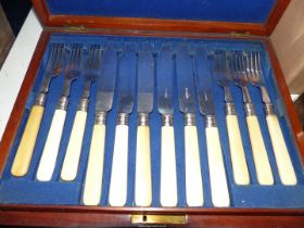 A twelve setting canteen of fish eaters in Mahogany case.