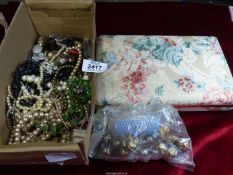 A quantity of costume jewellery including beads, clip on earrings, Mele jewellery box, brooches,
