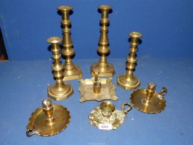 Two pairs of brass candlesticks, pair of brass chamber sticks, other chamber sticks, etc.