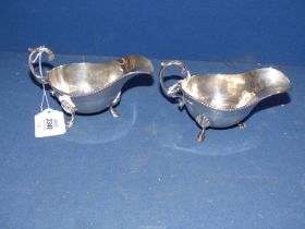 A pair of Silver Mappin & Webb sauce Boats on hoof feet with beaded rim, 1910, 194.9g.