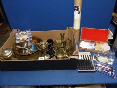 A quantity of brass and metals to include; chargers, a pair of barley twist candlesticks,