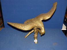 A large heavy brass eagle.