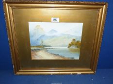 A framed and mounted watercolour seascape with sailing boats and rocky mountains,