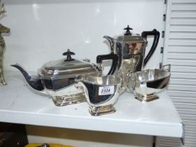 A four piece plated tea set in Art Deco style with black Bakelite handles.