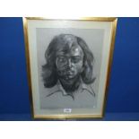 A framed and mounted Charcoal portrait of a gentleman, signed lower right J.