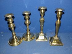 A pair of Georgian Adam style brass Candlesticks with square bases (one loose),