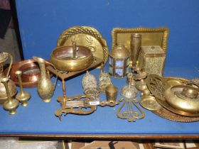 A large quantity of copper and brass to include vases, trivet, tea caddy, etc.