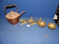 A quantity of brass including ploughing plaques, brass bowls and a copper coloured kettle.